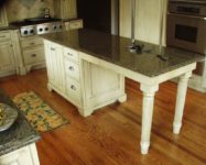 Custom kitchen cabinets by AppWood featuring 1 inch thick inset doors and antique glaze finish
