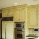 Custom kitchen cabinets by AppWood featuring 1 inch thick inset doors and antique glaze finish