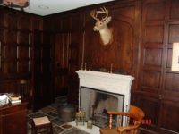 Custom cherry wall panels with hidden door by AppWood