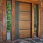 Wood meets metal. This contemporary door features walnut panels with steel bands.