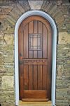 Stoneman Entry 520 - True Radius Entry door featuring a working speak easy and grill, rustic european design in Sapele Mahogany
